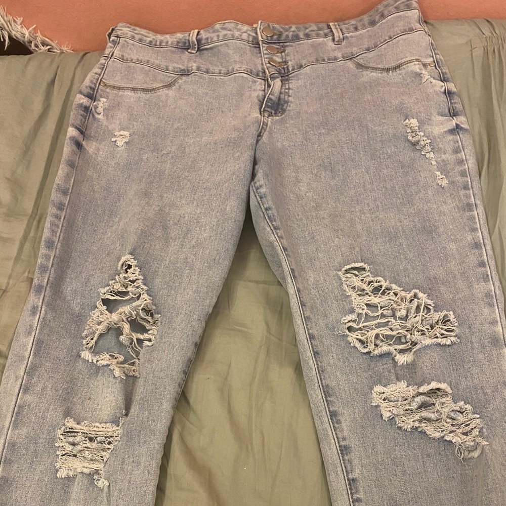 Light wash distressed high wasted jeans.